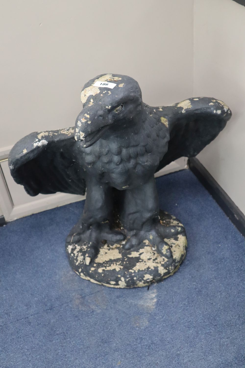 A pair of reconstituted stone eagle garden ornaments, height 78cm